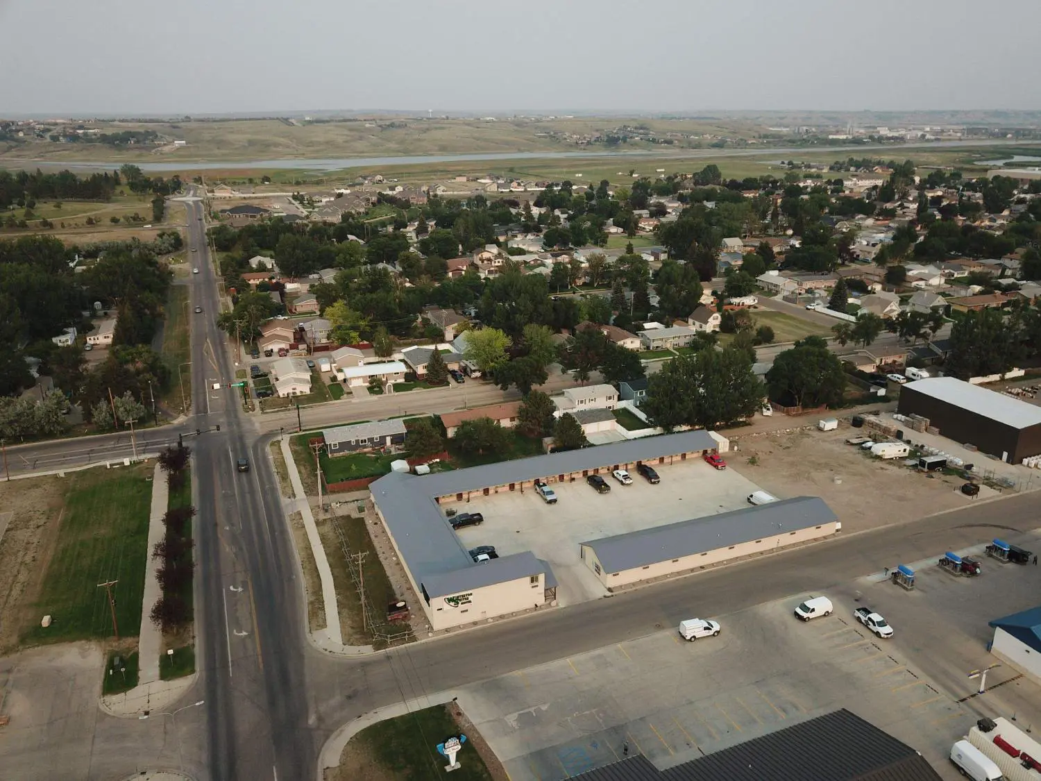 An aerial photo of a motel and houses